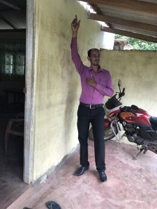 District staff points the flood level