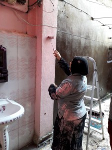 Woman painting washroom