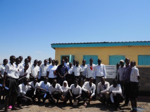 Handover of newly constructed school latrine with students