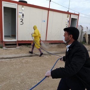 WASH service workers disinfect each communal WASH facility once a week. Camp management arranges a vehicle and disinfectant sprayer and PWJ provides disinfectant liquid.
