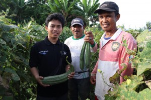 Happy farmers and rolo with crops